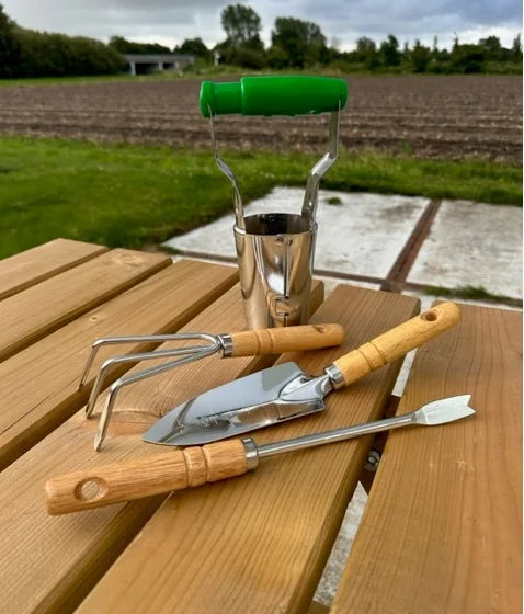 Garden tool set: hand shovel, rake, weed whacker, bulb planter
